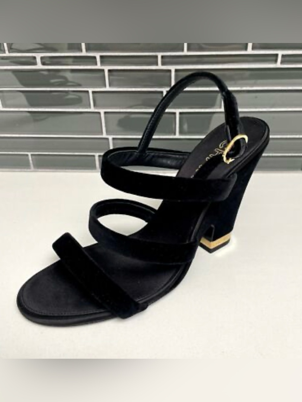 100% authentic Chanel Black Suede Strappy Heel Sandals with Gold Logo Accent